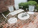 another fine wrought iron patio set with two concrete fountain frogs