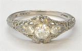 ANTIQUE PLATINUM RING W/ .30 CARAT DIAMOND CENTER.