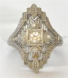 ANTIQUE PLATINUM FILIGREE RING. WITH .60 CTTW. DIAMONDS.