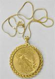 1908 ST. GAUDENS $20 GOLD DOUBLE EAGLE (NO MOTTO).
IN A 14K BEZEL PENDANT ON A 14K CHAIN.