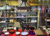 Wide-Angle Photo of Shelf & Table Items.