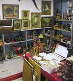 Wide-Angle Photo of Shelf & Table Items.