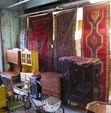 Wide-Angle Photo of Furniture & Oriental Rugs.