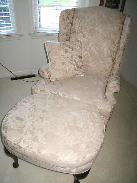 Pair of matching chairs with angel upholstery and one footstool.
