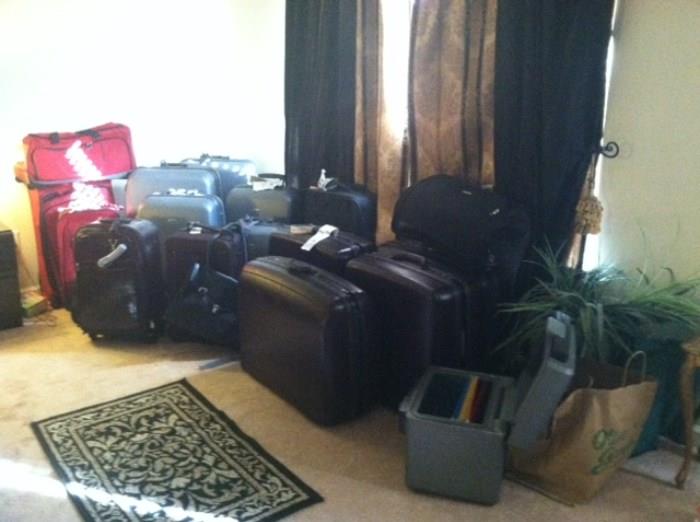 Luggage galore. These are nice barely used luggage sets. Also seen in this pic is a fire proof safe and lockable file box. Not shown are tons of office supplies, tables, desks, chairs and file cabinets.