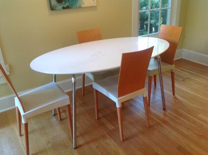 Contemporary table and Starck chairs