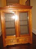 small antique cabinet -- can sit on top of table or chest or hang on wall