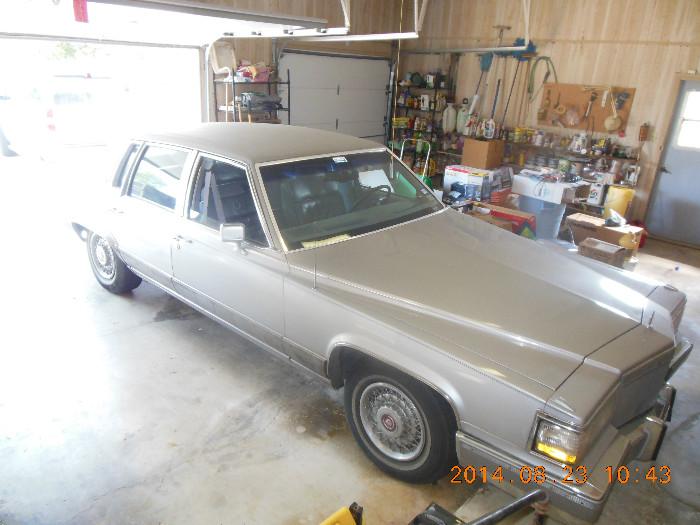1990 Cadillac Brougham d'elegance, 4 door, 130,000 mileage,  leather interior, silver color, runs great.  Asking price :  $2.495.00