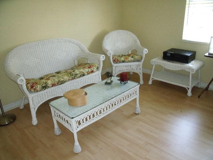 White wicker set with settee, 2 chairs and small side table.  coffee table does not match other pieces shown here