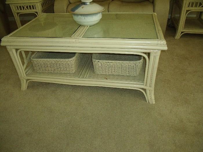 Rattan coffee table with wicker basket.  glass top