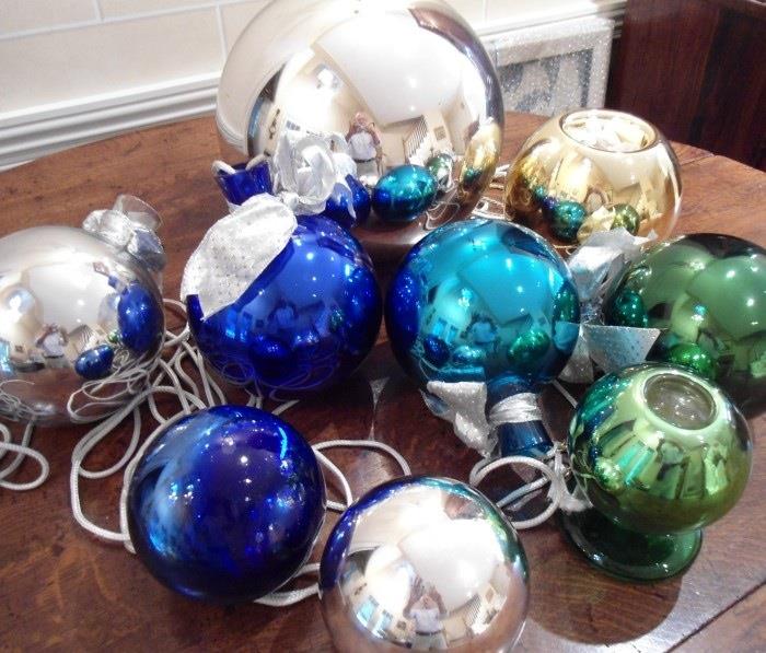 Gigantic, vintage mercury glass "gazing balls" used as Christmas decorations.