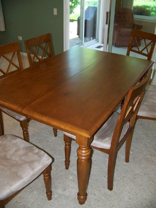Dining room table with 3 leaves and pads.  