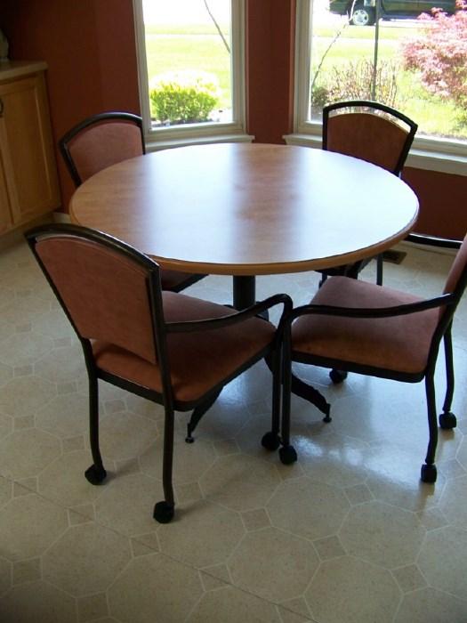 Kitchen table and chairs. Chairs have casters for great  mobility.