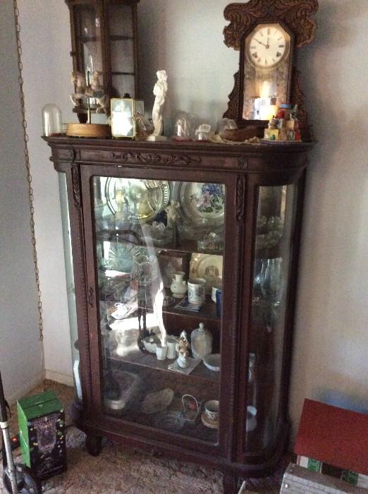 Victorian Bowfront Cabinet with Collectibles and Clock