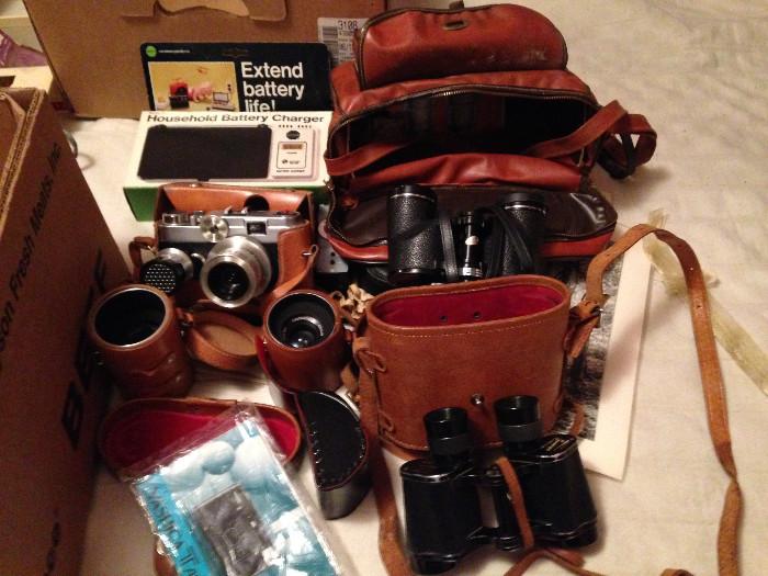 Vintage, camera, binoculars, and slide projector equipment.