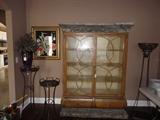 Etegere - faux top and base.  Metal stands, framed art, purple glass vase with arrangement