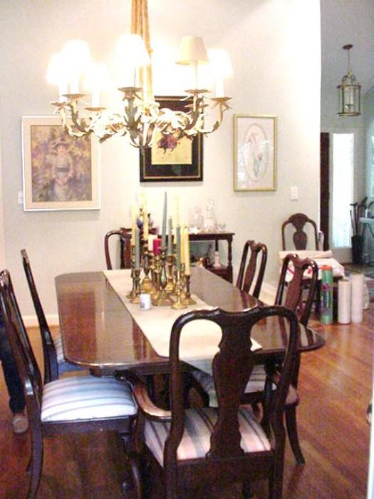 Ethan Allen dining table and six mahogany chairs.  Dining table has three leaves and pads
