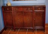 Hallmark Quality Furniture early 1940's mahogany veneer buffet with glass top.