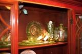 Vaseline glass collection: Plates, bowls, cream/sugar, vases, cookie jar, separated dish, and more.