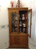 China hutch, full of Santa figurines