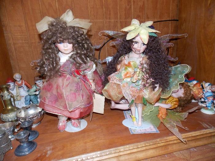 two of about 5 fairy porcelain dolls