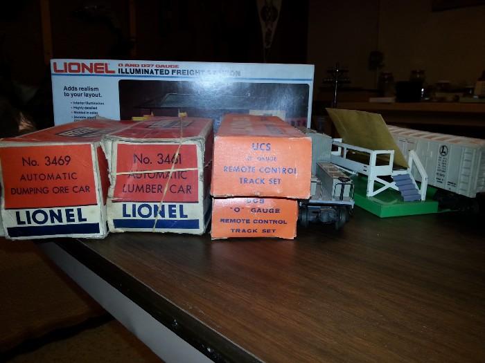 Assortment of Lionel O gauge trains and accesories