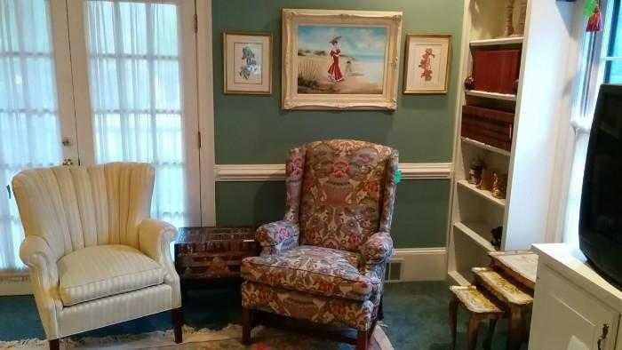 LOVE the artwork in this house. I think the artist was either an elephant, or blind. The Goldilocks chairs are actually kinda nice. There's also a nice Asian chest on stand, comfortably nestled between the chairs.