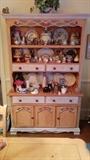Ahh, now here's something you don't see everyday. This is the hutch from a dining set that includes table w/leaf, six chairs and buffet, all tarted up in a "French Country" style. The hutch is about to fall over with a mish-mash of smalls that must be seen to be believed. 