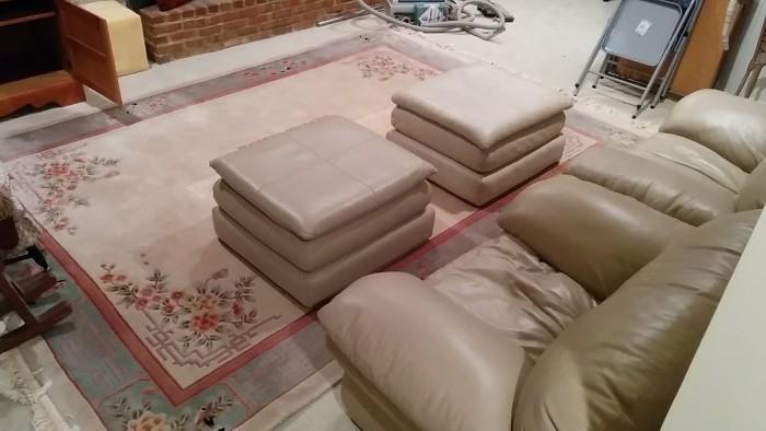 Just what you've been waiting for! A matched pair of leather armchairs, just in time to drank a cold PBR, watch the game, in the privacy of your own man-cave. We also have two feminine, yet strong, room-size Chinese rugs.