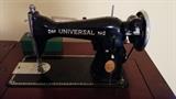 Unbelievably clean 1950's "Universal" sewing machine, with original tin box with all attachments. I think this was a private label by Singer sewing machine, exported to Japan, but, I could be wrong. Don't hate. 