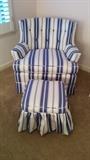 Very cute blue/white striped armchair and matching ottoman. The vintage chair hiding under the curtain is 1950's.