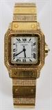 Lot#2030, CARTIER 'SANTOS' 18KT YELLOW GOLD & 3.25 CT. DIAMOND MAN'S WRISTWATCH, C. 1980, #296000466.Cartier 'Santos' automatic wristwatch with square case, white enamel face, Roman numerals, inscribed: "Cartier" above 6;00. Stamped 750 on band clasp. 136.7 gms total wt.  3.25 cts. of diamonds total, diamonds are H -I color and VVS2 - VS1 clarity.  Seyfried Diamond Jewelers, Ann Arbor, MI replacement value appraisal in customer file.