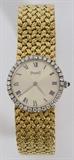 Lot#2031, 18 KT YELLOW GOLD PIAGET LADY'S WATCH.With diamond surround dial, # 926D2; 2999860.