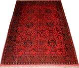 Lot#2258, PAKISTAN TRIBAL ORIENTAL RUG 6'2" X 4'4"Hand woven, wool and camel hair. Red field, black secondary color. From the collection of Irene Walt, Huntington Woods, Michigan.