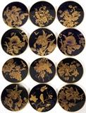 Lot#1081, PIRKENHAMMER PORCELAIN CABINET PLATES, LATE 19TH C., TWELVE, DIA 9"Including a set of 11 dessert plates, each is uniquely decorated in gilt stencil with a fruiting branch on a cobalt blue ground and hand lettered "B 5120" in red on the reverse, together with 1 plate that is hand decorated in gold with a bird on a flowering branch, cobalt blue ground, stamped in black with crossed hammers on the reverse, probably for Fischer & Mieg, and hand numbered 2602. Total 12 pcs.