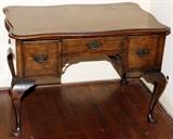 Lot#1186, ENGLISH WALNUT PARQUETRY DESK, EARLY 20TH C., H 29", W 43", D 28"Parquetry top, fitted with three drawers, raised on cabriole legs ending in pad feet.