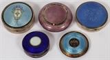 Lot#1273, AUSTRIAN, NORWEGIAN & OTHER GUILLOCHE ENAMEL COSMETIC BOXES, C. 1910-1920, FIVE, DIA 2"-2 3/4"Including 1 Austrian blue guilloche powder compact, a basket and flowers on lid with gold wash interior and mirror; 2 light blue guilloche compact, round form cases and floral and leaf motif lids, one with a gold wash interior, both have a mirrored panel inside; 1 Norwegian lilac guilloche box by Marius Hammer, Bergen, 930 silver; and 1 other box, cobalt blue enamel exterior with St. Christopher at the center of the hinged cover.