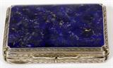 Lot#1277, CONTINENTAL .800 SILVER & LAPIS BOX, C, 1910, L 3"An .800 silver box inset with lapis at the hinged cover, opening to a gold wash interior, foliate detail on the reverse.  Stamped "800" within.  Measures H.1/2" x 3" x 2", and weighs approximately 2.3 troy oz. gross.