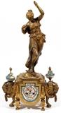 Lot#1304, FRENCH GILT METAL & PORCELAIN FIGURAL CLOCK, LATE 19TH C., H 24", W 13", D 5"Standing allegorical figure, Diana, raised on an architectural base. Flanked by goat masks and porcelain mounts and having a porcelain dial.