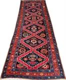 Lot#1335, KAZAK ORIENTAL RUNNER, C. 1920, 10' 11" X 3' 6"Forms in red, rust and blue borders. Low pile.