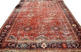 Lot#1337,SAROUK ORIENTAL RUG, C. 1900, 11' 2" X 9' 4"Brick red field with navy border.