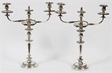 Lot#1346, WM. & GEO. SISSONS, ENGLISH SHEFFIELD PLATE THREE-LIGHT CANDELABRA, LATE 19TH C., PAIR, H 20 1/4"Flanked by scrolling arms, hallmarked at the base with a bell. 19th century. Measuring H.20 1/4" x 16 1/4".