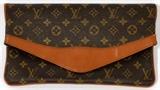 Lot#1492, LOUIS VUITTON MONOGRAM CANVAS ENVELOPE CLUTCH, W 13"Single fold at the front, clips open to a zippered pocket and a suede lined interior pouch, featuring vintage Louis Vuitton paper label at the pocket.  Measures W. 13" x 7".