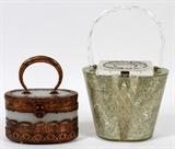 Lot#1506, LUCITE HANDBAGS, MID 20TH C., TWO..One purse is of clear lucite enhanced with rhinestones while the second is opaque with faux copper decoration.