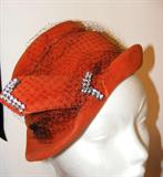 great red hat with rhinestone embellishment.