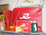 Hawaaian Airline collectible include small suitcase and tiney suitase.