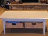 Pottery Barn coffee table with basket storage.