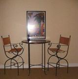 Pub table with leather chairs.