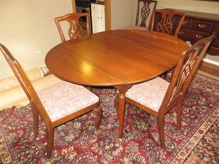 Cherry dining room table and six chairs