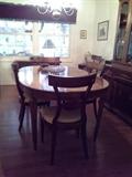 Large oval table with 6 matching chairs includes to leaves
